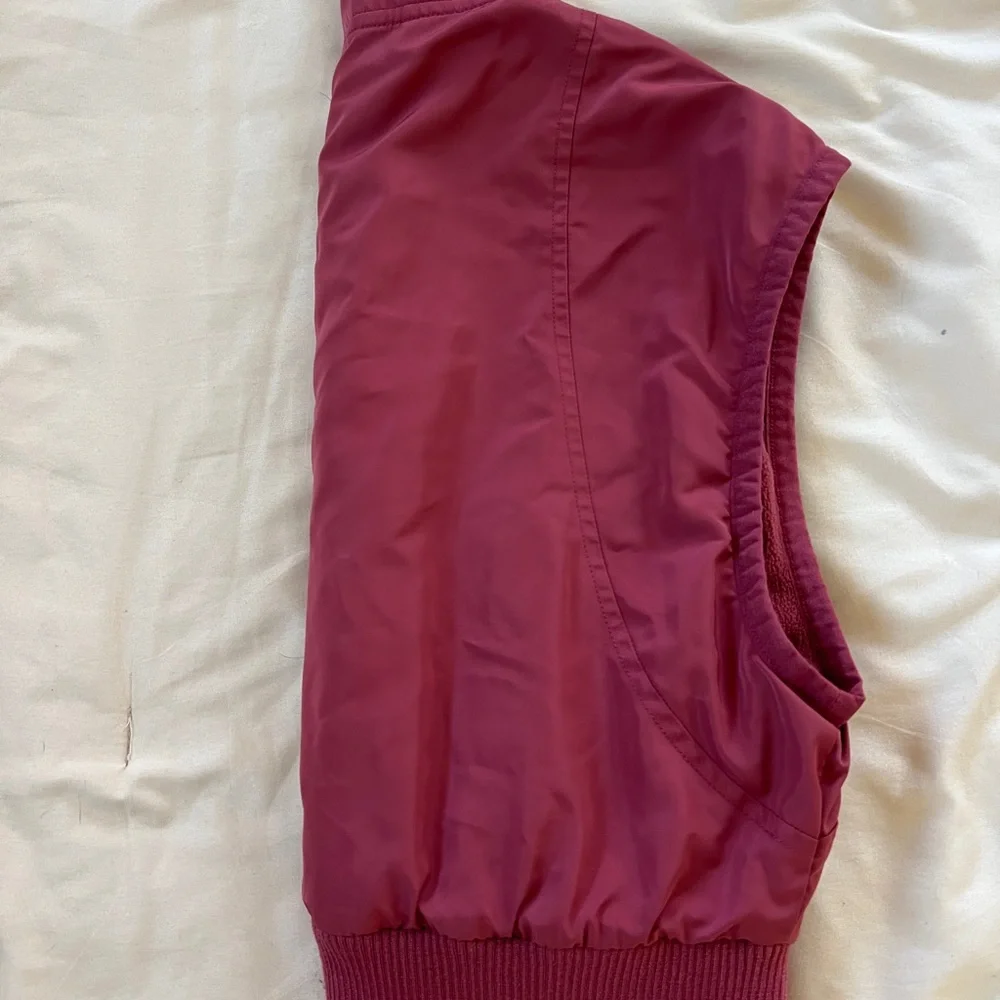 ALO Yoga Sleeveless Zip-Front Puffer Vest in Deep Berry - Picture 3 of 4